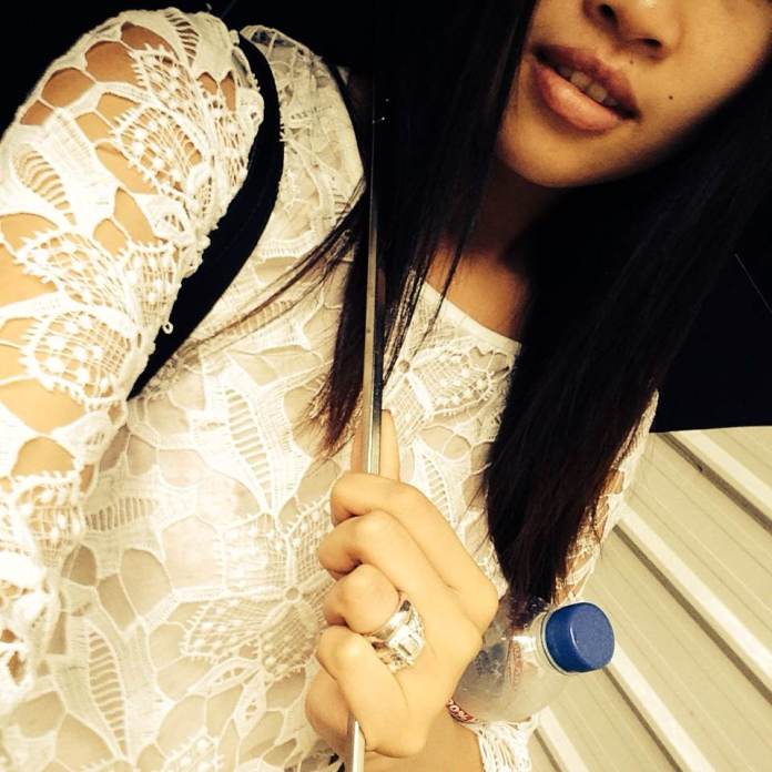 Wearing a white lace top from ZARA and multiple Carrie K rings mixed with my own.