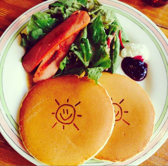 Cute, smiley-face pancakes in a cafe in hongdae, Seoul, South Korea.