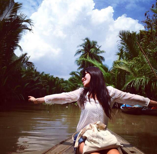 In my happy place: carefree, stress-free, outdoors. Sitting in a sampon going down Mekong River, Ho Chi Minh, Saigon, Vietnam.