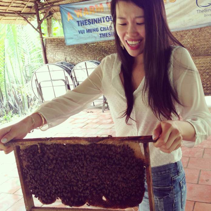 Bullied into carrying bees by our tour guide. Ben Tre, Vietnam.